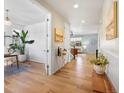 Inviting entryway with hardwood floors and light walls leads to a bright living space at 800 Boulder Peak Ave, Erie, CO 80516
