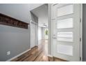 This entryway features hardwood floors and plenty of natural light. There is a coat rack on the wall at 14035 Touchstone St, Parker, CO 80134