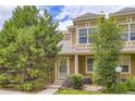 Charming home displaying an exterior elevation with mature trees and meticulous landscaping at 14129 E Dickinson Dr # D, Aurora, CO 80014