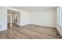 Bright living room featuring hardwood floors and an open floor plan at 238 Kino Court, Brighton, CO 80601