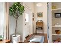 Bright and spacious entryway with hardwood floors and built-in shelving at 1152 Clayton St, Denver, CO 80206