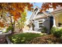 Gray craftsman home with fall foliage and a spacious yard at 1152 Clayton St, Denver, CO 80206