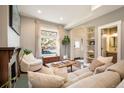 Cozy living room featuring a fireplace and large windows at 1152 Clayton St, Denver, CO 80206