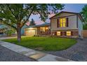 A well-maintained two-story home with lovely landscaping and inviting curb appeal at 18601 E Louisiana Ave, Aurora, CO 80017
