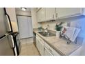 The functional kitchen features ample countertop space and storage at 7695 E Quincy Ave # 207, Denver, CO 80237