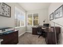 Bright home office with natural light, a desk, and ample storage space for a productive work environment at 1867 W 137Th Ln, Broomfield, CO 80023