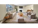 Virtually staged living room featuring neutral tones and a cozy fireplace at 10547 Pompey Way, Northglenn, CO 80234