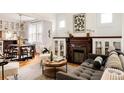 Inviting living room with hardwood floors, fireplace, and natural light at 4224 N Clay St, Denver, CO 80211
