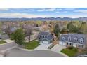 Expansive aerial view of the home showcasing its location and mountain views at 9391 W Hialeah Pl, Littleton, CO 80123
