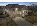 Inviting two-story home with a two-car garage, lovely front porch, and manicured lawn at 24192 E Alamo Dr, Aurora, CO 80016