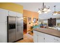 Kitchen features stainless steel appliances and white cabinetry at 723 Eaton Rd, Palmer Lake, CO 80133