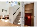 Open staircase with carpeted steps, leading to a light-filled upper level at 479 Blue Lake Trl, Lafayette, CO 80026