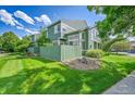 This property has a green backyard with a wooden fence and a small landscape area at 1229 James Cir # 1, Lafayette, CO 80026