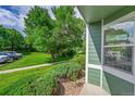 View of the green lawn, trees and landscaping of the property at 1229 James Cir # 1, Lafayette, CO 80026