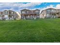 Beautifully landscaped lawn with a view of the townhome's exterior at 13860 Ash Cir, Thornton, CO 80602