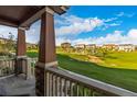 Scenic view from porch overlooking community green space, playground, and neighborhood homes at 13860 Ash Cir, Thornton, CO 80602
