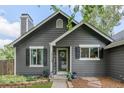 Close up view of the gray single-Gathering home featuring a welcoming front entrance with decorative planters at 18056 E Bellewood Dr, Aurora, CO 80015