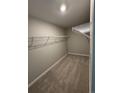 Spacious walk-in closet with wire shelving and neutral carpeting, offering ample storage space at 9353 Yampa Ct, Commerce City, CO 80022