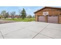 Expansive driveway leading to a two-car garage, complete with a basketball hoop, for recreational fun at 34101 Columbine E Trl, Elizabeth, CO 80107