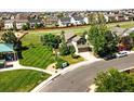 Gorgeous aerial shot of a home with manicured lawn and landscaping in a desirable neighborhood at 22501 E Belleview Pl, Aurora, CO 80015