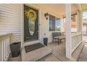 Inviting front porch with seating and decorative touches at 20338 E 48Th Dr, Denver, CO 80249