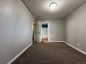 Neutral bedroom with carpet, fresh paint, and ensuite bathroom at 921 Dakin St, Denver, CO 80221
