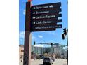 Street sign pointing to RiNo East, Downtown, Larimer Square, and Civic Center at 2500 Walnut St # 102, Denver, CO 80205