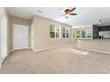 Inviting living room with large windows, seamlessly connecting to the kitchen area at 9637 E 5Th Ave # 101, Denver, CO 80230