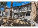 Charming home featuring a cozy patio, ideal for entertaining, and a stone accent wall for a rustic touch at 2308 Hearth Dr # 37, Evergreen, CO 80439