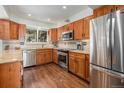 Modern kitchen features stainless steel appliances, granite countertops, and ample wood cabinetry for storage at 2308 Hearth Dr # 37, Evergreen, CO 80439