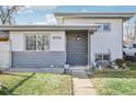 House exterior featuring gray siding and a walkway at 6721 Birch St, Commerce City, CO 80022