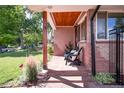 Charming front porch area with comfortable seating, offering a welcoming outdoor space at 4585 Hooker St, Denver, CO 80211