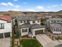 Stunning aerial view of a luxurious two-story home in a Primary-planned community at 9724 Cantabria Pt, Lone Tree, CO 80124