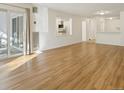 Bright and spacious living room featuring access to a patio and laminate flooring at 2880 S Locust St # 109S, Denver, CO 80222