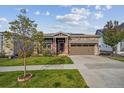 Charming single-Gathering home with a two-car garage, stone and siding exterior, and manicured lawn at 8726 Holman Cir, Arvada, CO 80005