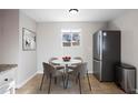 Bright dining area with table and four chairs at 4225 S Logan St, Englewood, CO 80113