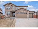 Charming two-story home featuring a stone and siding facade, complemented by a spacious driveway and well-kept lawn at 25064 E Archer Pl, Aurora, CO 80018