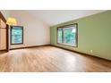 Living room with hardwood floors, bay window, and natural light at 5480 S Holly St, Greenwood Village, CO 80111