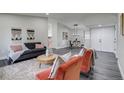 Inviting living space showcasing open floor plan, stylish furnishings, and plenty of natural light perfect for relaxation at 3402 S Olathe Way, Aurora, CO 80013