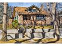 Charming brick home with a well-maintained front yard and mature trees. The property is located in Denver at 721 Monroe St, Denver, CO 80206