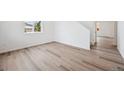 Bright living room showcasing beautiful floors, natural lighting, and an open layout at 24707 E 40Th Ave, Aurora, CO 80019