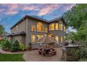 Large backyard patio perfect for outdoor entertaining with a privacy wall and ample seating at 19061 Eagle Ridge Dr, Golden, CO 80401