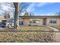 House exterior showcasing a walkway and nicely landscaped yard at 6440 - 6450 W 35Th Ave, Wheat Ridge, CO 80033