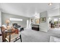 Cozy living room featuring neutral tones, comfortable seating, and ample lighting at 7861 Osceola St, Westminster, CO 80030
