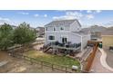 Spacious backyard with a large deck, perfect for entertaining, plus a partially fenced yard at 11594 Yellow Daisy Dr, Parker, CO 80134