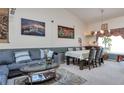 Inviting living room featuring a comfortable gray sofa and a large painting, perfect for relaxation at 2246 S Ensenada St, Aurora, CO 80013