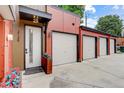Modern garage entrance with three separate single door garages leading to the front door at 2138 N Glenarm Pl, Denver, CO 80205