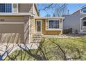 Attractive home exterior with a well-manicured lawn and inviting entryway at 11302 Tumbleweed Way, Parker, CO 80138