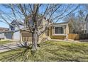 Two-story home with a charming exterior, featuring a well-maintained lawn at 11302 Tumbleweed Way, Parker, CO 80138