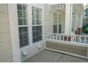Inviting front porch with white railings, providing a cozy outdoor space at 640 S Yarrow St, Lakewood, CO 80226